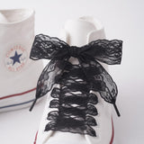 Lacets en dentelle noirs, noeud